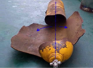 Fig. 12 (Left). A gas container, being essentially a thin-walled cylindrical pressure vessel, was torn apart along the longitudinal axis, when the gas pressure exceeded a critical value [8].